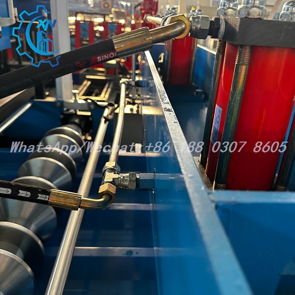 All-metal hydraulic piping system on XINNUO profile sheet machine — high-pressure steel lines replace rubber hoses for leak-free, maintenance-reduced operation