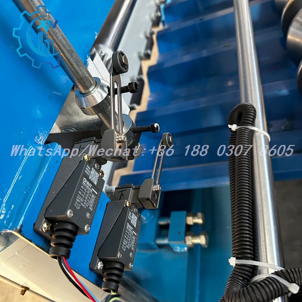 Schneider, Omron, Siemens branded electrical components inside the control cabinet of a profile sheet making machine — Trapezoidal Roof Panel Forming Machine PLC panel