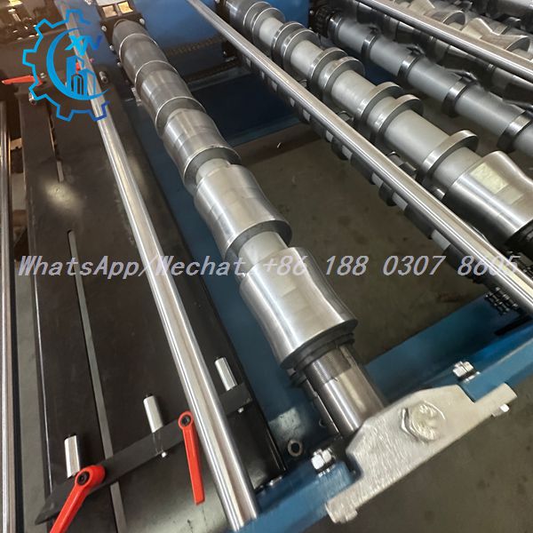 IBR roof sheet roll forming machine entry roller station with polished chrome-plated shafts and manual adjustment levers for South Africa market
