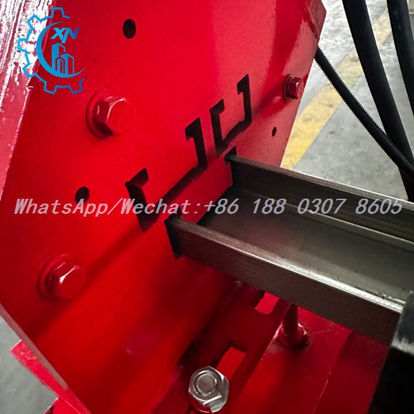 Galvanized stud fed through punching die of light gauge steel machine