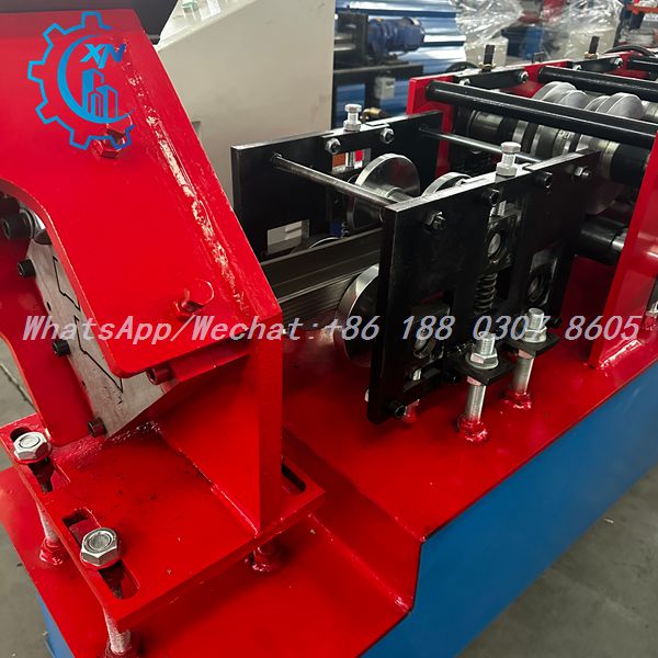 Metal strip being formed by rollers of stud and track machine