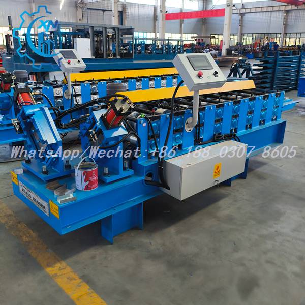 Metal stud roll forming machine with blue frame and yellow guards