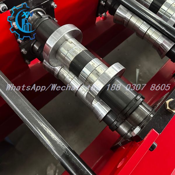 Roller stack with interlocking rings on steel frame roll forming machine