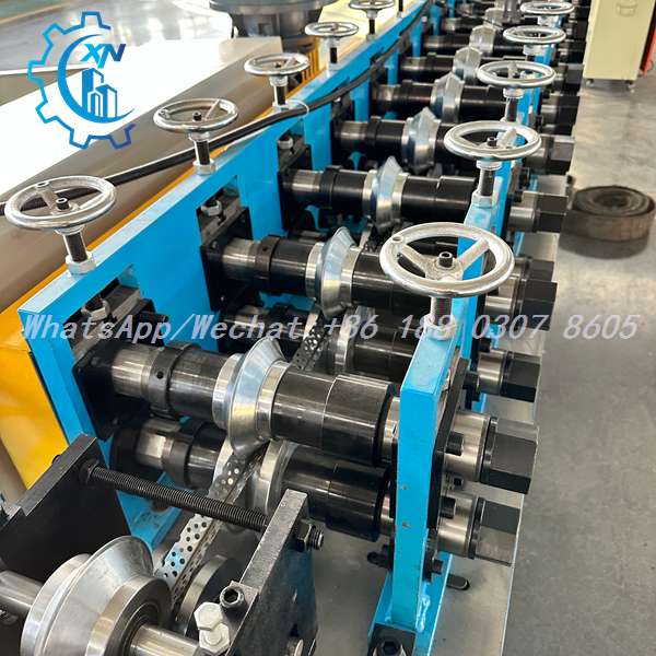 Side view of steel stud making machine with handwheel adjustment
