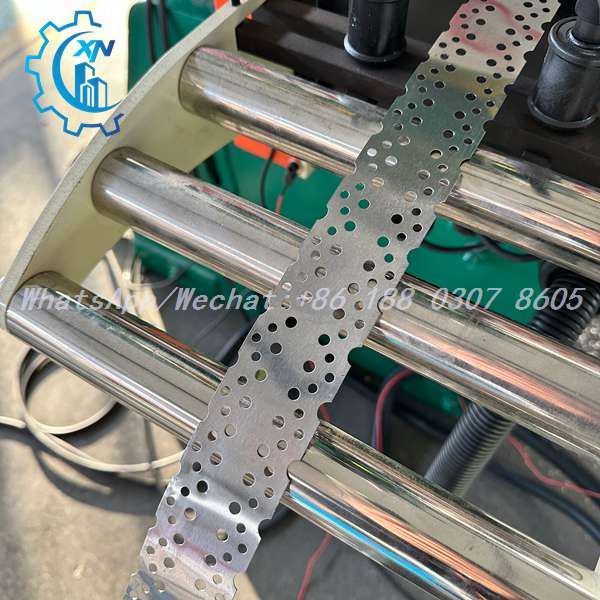 Perforated strip fed through rollers of steel stud making machine
