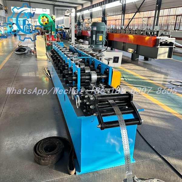 Side view of stud making machine with forming stations and exit ramp