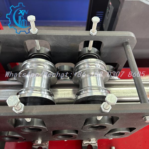 Workpiece guided by rollers on automatic rolling shutter machine