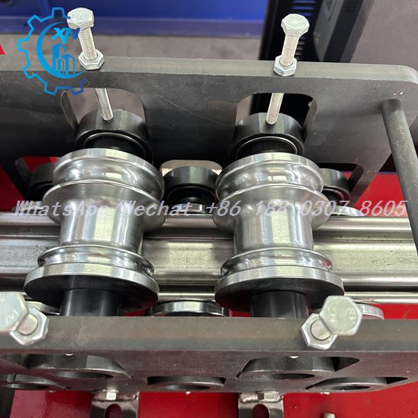 Spool rollers guiding square tube on shutter making machine