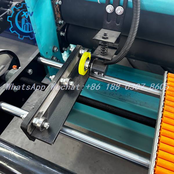 Encoder measuring wheel on IBR machine with orange rollers
