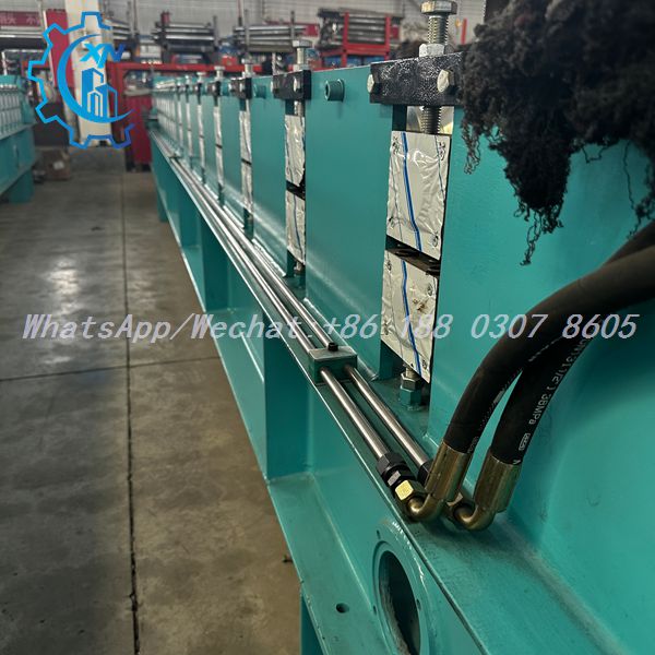 Full length view of IBR roof sheet making machine with hydraulic pipes