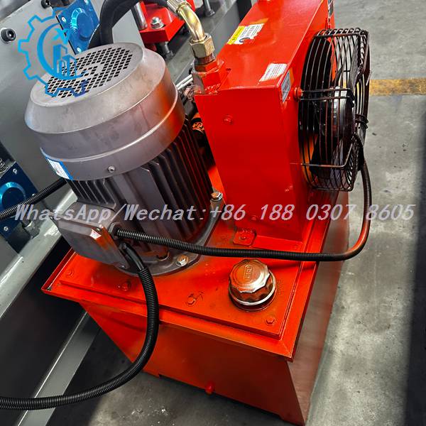 Hydraulic power unit with red tank on ridge cap machine