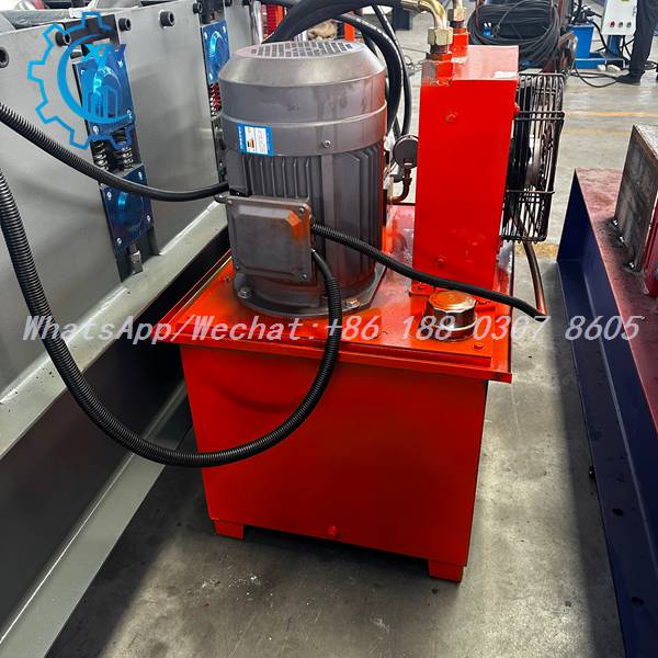 Hydraulic pump station with orange tank on ridge forming machine
