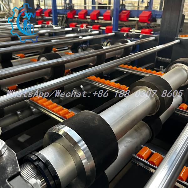 Rubberized rollers and orange guides on rock wool sandwich panel line