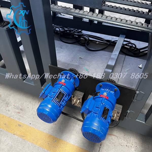 Twin blue motors and roller conveyor on sandwich panel making machine