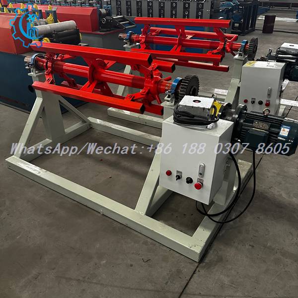 Twin red expanding mandrels on motorized decoiler