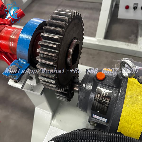 Reduction gears with blue bearing block on motorized decoiler