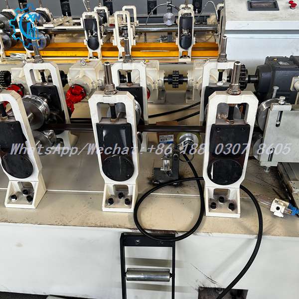 Forming stations and chain drive on roller shutter door machine