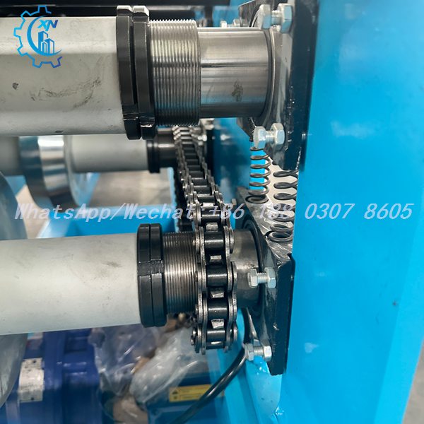 Spring tensioned chain drive of semi automatic ridge cap machine